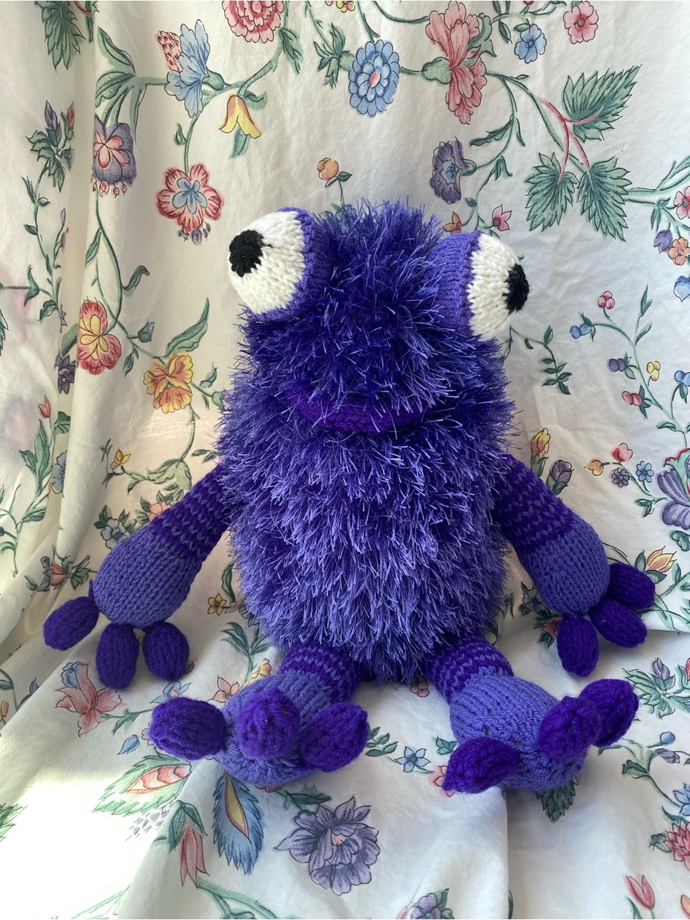 Purple crocheted amigurumi fuzzy monster plush toy